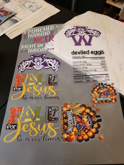 "Explore vibrant and creative DTF transfer designs, including inspirational messages like 'Fall for Jesus,' festive Thanksgiving graphics, and custom logos. Perfect for t-shirt transfers, DIY crafts, and storefront projects. 